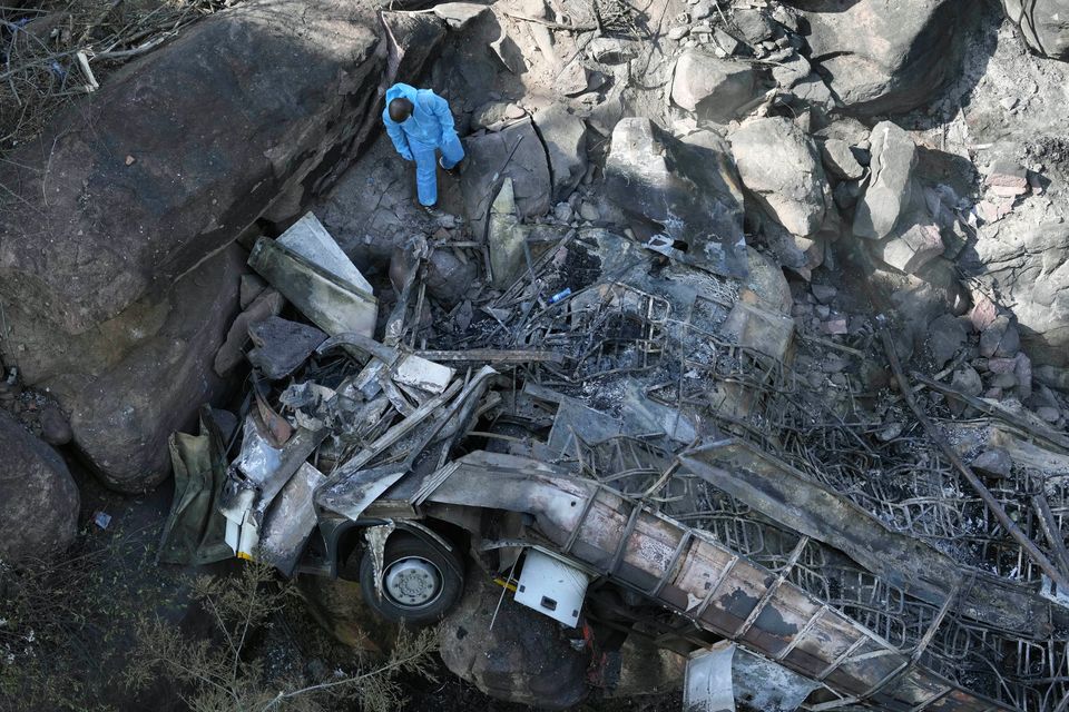Wreckage of the bus that plunged off a bridge in South Africa. Photo: AP