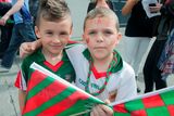 thumbnail: 30/08/2015  
GAA fans (L to R) Kacy Mannion 7 & Senan Farrell 7 both from Charlestown  at the GAA Semi Final between Dublin & Mayo in Croke Park, Dublin.
Photo: Gareth Chaney Collins