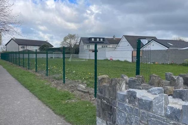 ‘It just seems bizarre’ – council intervenes as public green where children play is fenced off without permission