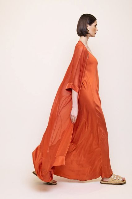 Silk bias cut maxi dress in a firey orange, €325, worn with drape jacket, €235, ecrustudios.com  