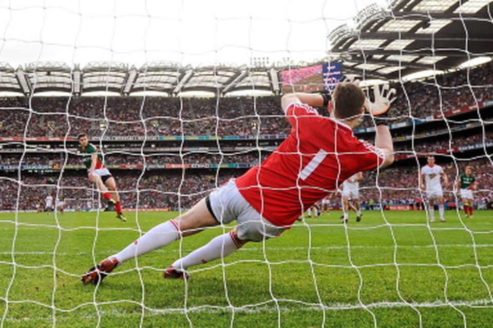 Mayo's Alan Freeman scores his side's first goal from a penalty past goalkeeper Pascal McConnell