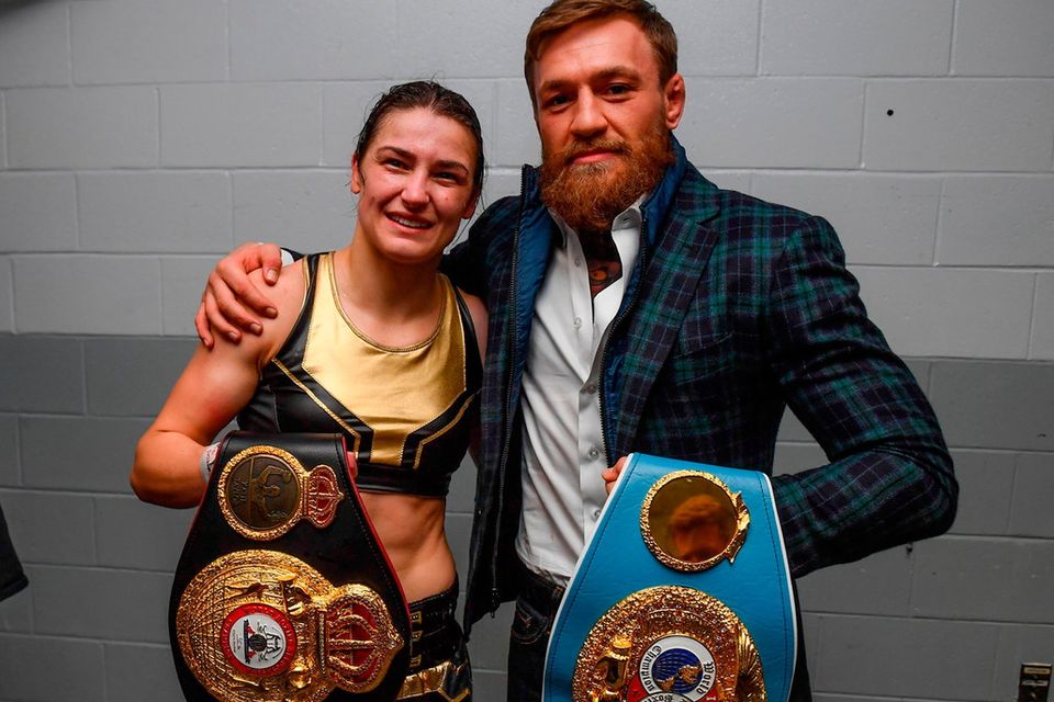 Conor McGregor poses with Katie Taylor. Photo: Sportsfile