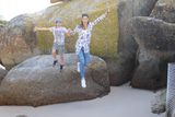 thumbnail: Jumping for joy at Boulders Beach, where we saw the penguins, just off the plane and ready for adventure