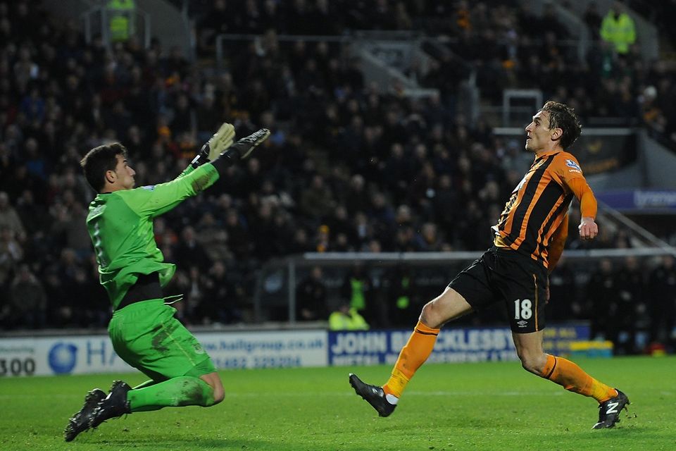 Hull City's Nikica Jelavic, right, scores the second goal against Everton