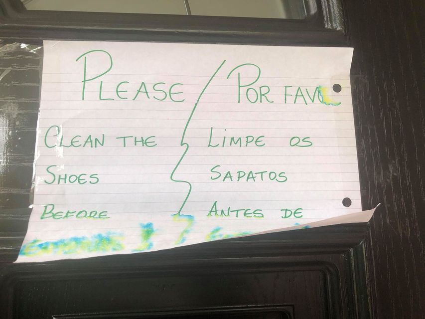 A sign on the door of the house which Colin Carter shares with a number of foreign nationals