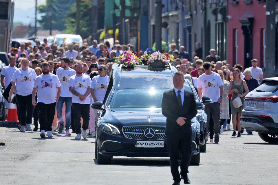 The cortege for the funeral of Molly Dempsey makes its way through Baltinglass, Co Wicklow followed by a large crowd of mourners. Photo: Colin Keegan, Collins Dublin