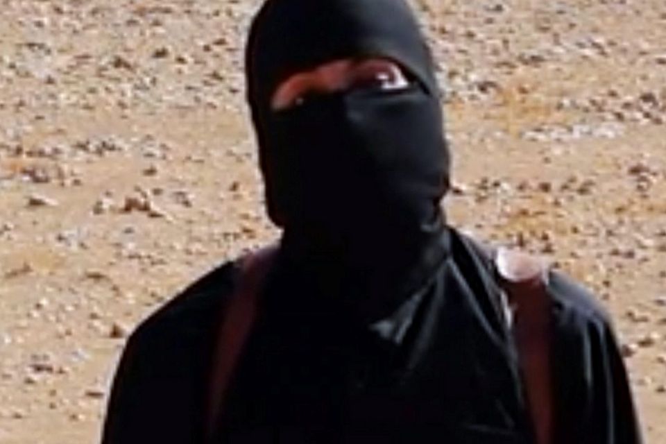 Undated image shows a frame from a video released Friday, Oct. 3, 2014, by Islamic State militants that purports to show the militant who beheaded of taxi driver Alan Henning