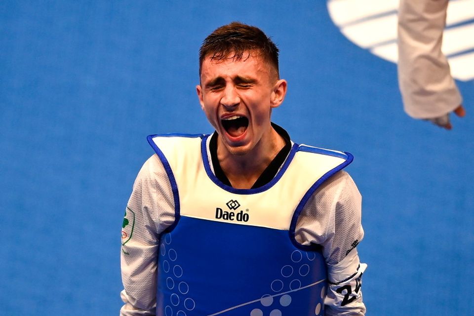 Jack Woolley of Ireland celebrates after winning his Taekwando Men's 58kg semi final