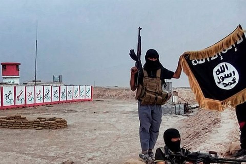ISIL millitants with the trademark Jihadist flag.