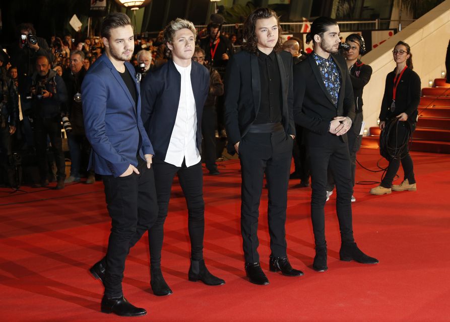 Members of British band One Direction (L to R) Liam Payne, Niall Horan, Harry Styles and Zayn Malik pose upon their arrival at the Palais des Festivals to attend the 16th Annual NRJ Music Awards