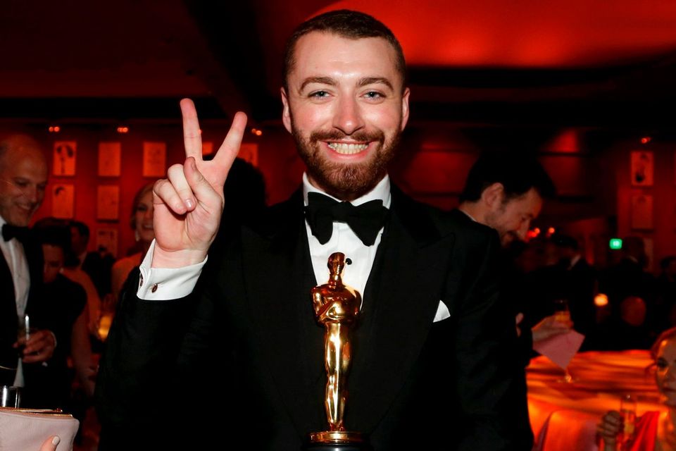 British singer-songwriter Sam Smith, winner for Best Original Song for "Writing's on the Wall" from the movie "Spectre", gestures at the Governors Ball following the 88th Academy Awards in Hollywood, California February 28, 2016.  REUTERS/Lucy Nicholson
