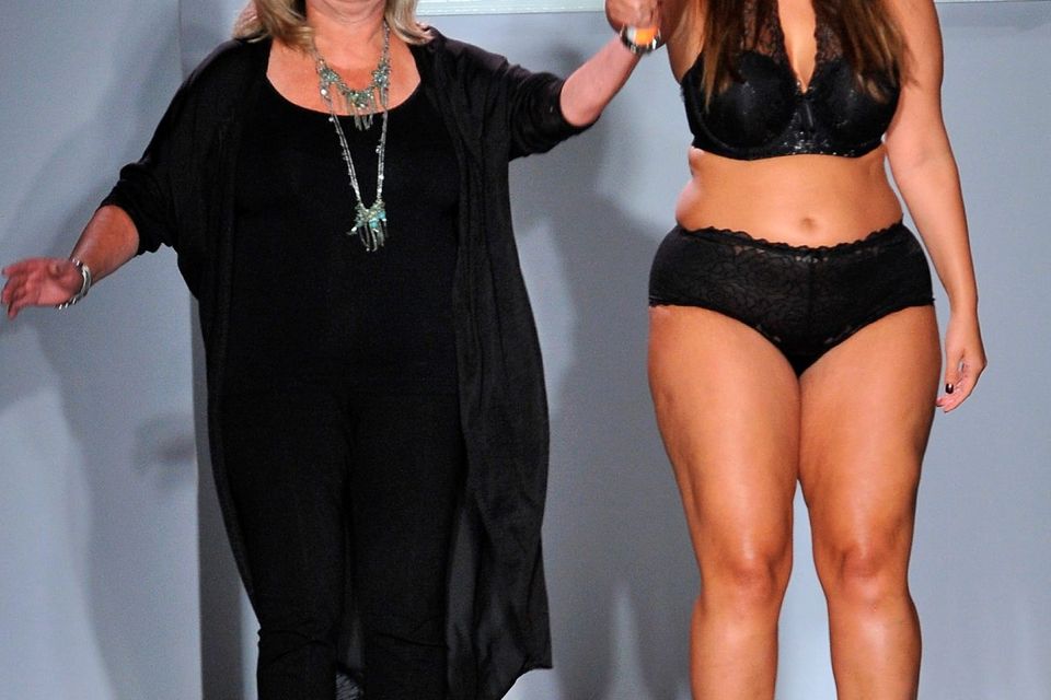 Designer Ashley Graham (R) acknowledges the audience following the Addition Elle/Ashley Graham Lingerie Collection fashion show during the Spring 2016 Style 360 on September 15, 2016 in New York City.  (Photo by Fernando Leon/Getty Images)