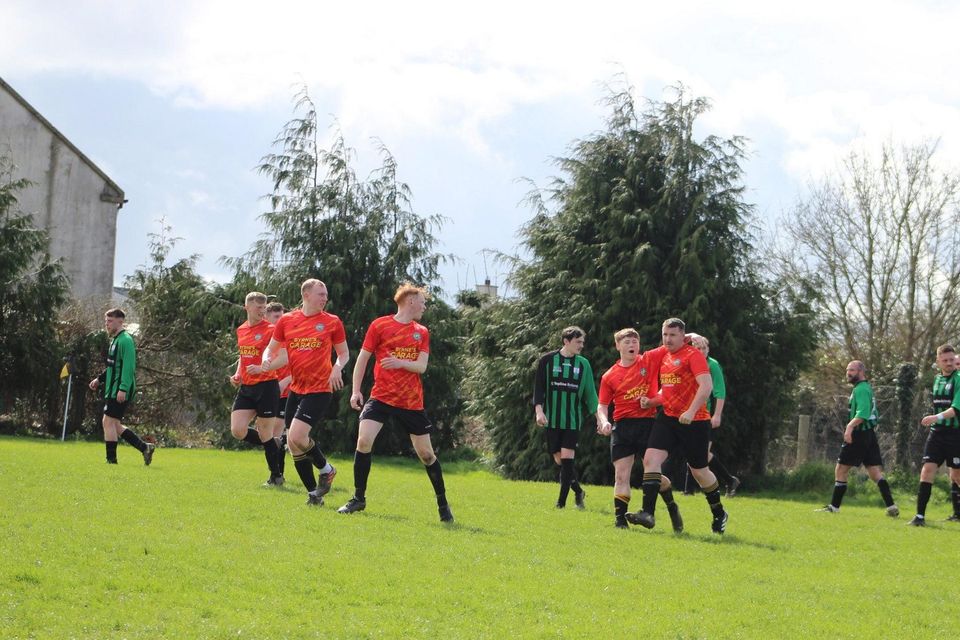 Carnew's Ben Gilligan and his uncle John Kavanagh celebrate after a goal at the Back Alley. Photo: Lorraine Gilligan