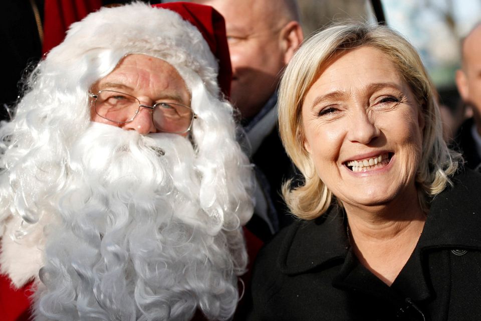 Far-right National Front party leader and candidate for the 2017 presidential election, Marine Le Pen, visits a Christmas market in Paris as she continues her quest to win over voters before the people of France vote in April