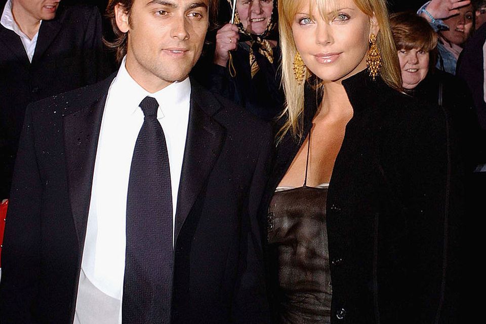 South African actress Charlize Theron and ex boyfriend Stuart Townsend attend the Irish Film and Television Awards at the Burlington Hotel on November 1, 2003 in Dublin, Ireland.