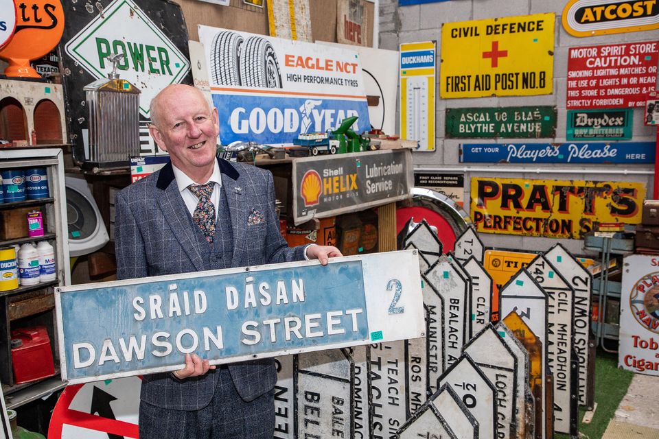 Hugh Nolan, 65, with one of his 200 vintage Irish street signs which along with a 1970 Rover V8 and other memorabilia will go under the online hammer in his ‘retirement auction’ (Michael Donnelly/MediaConsult/PA)