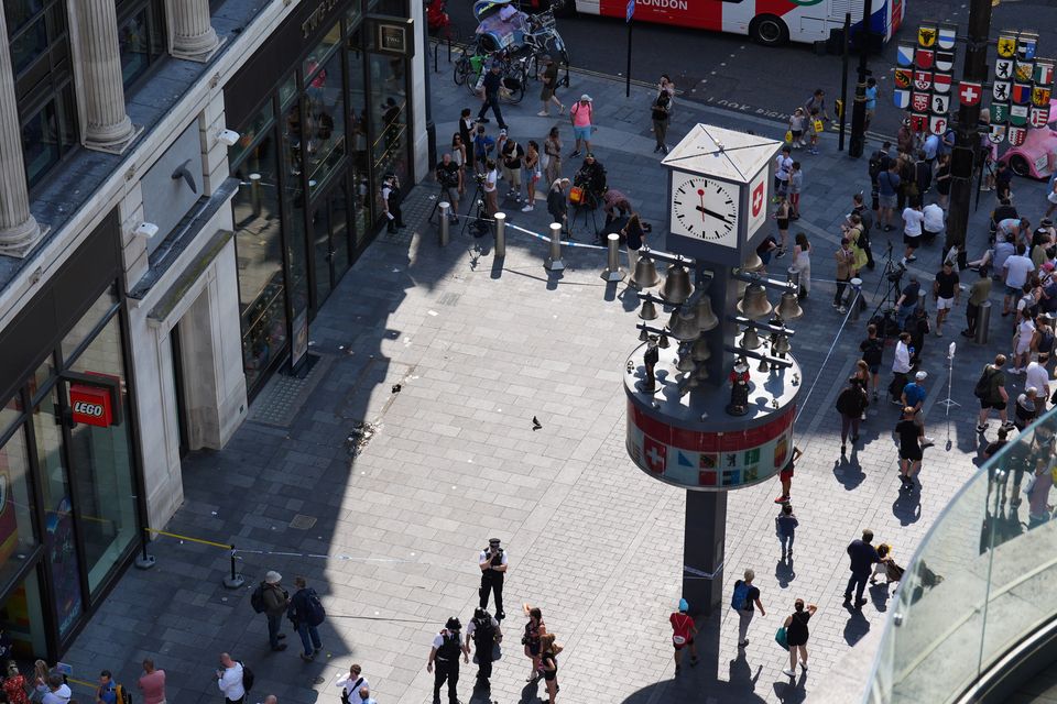 Police officers at the scene in Leicester Square, London (James Manning/PA)