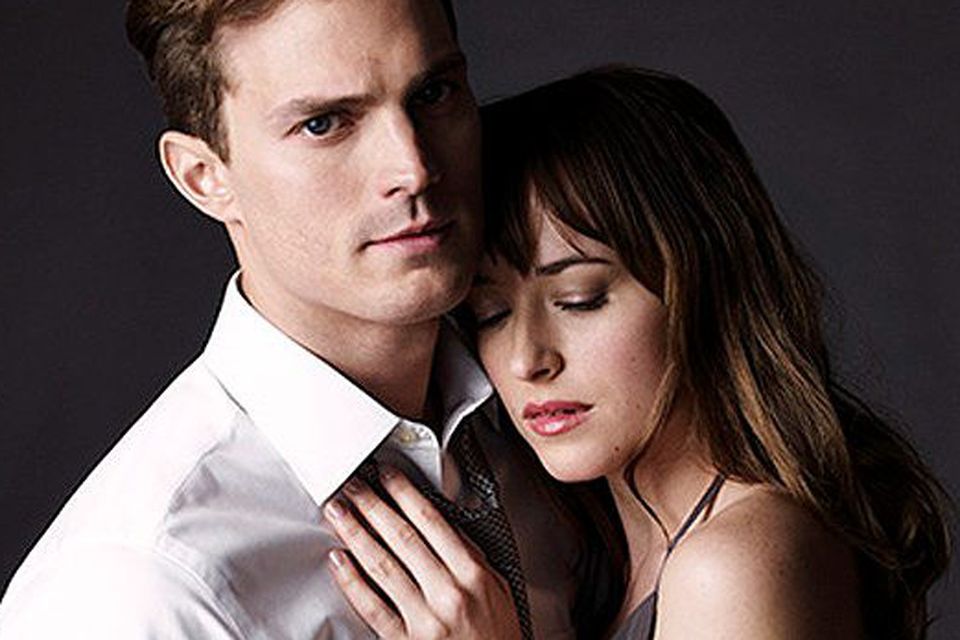 Jamie Dornan as Christian Grey with Dakota Johnson in ‘Fifty Shades of Grey’