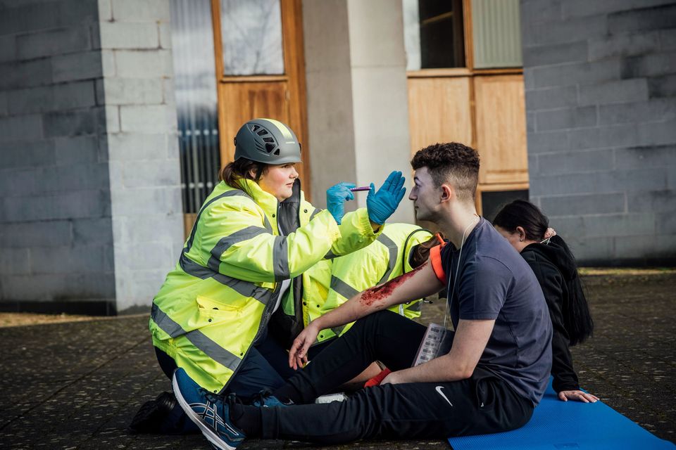 A civilian is seen to by a UL Paramedic Student as the Largest ever immersive simulation thrusts UL students into emergency situation. Photo: Brian Arthur