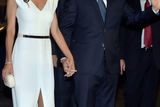 thumbnail: Handout photo released by Noticias Argentinas of Argentina's President-elect Mauricio Macri (R) waving as he arrives to the Colon Theater with First Lady Juliana Awada for a gala in Buenos Aires on December 10, 2015.