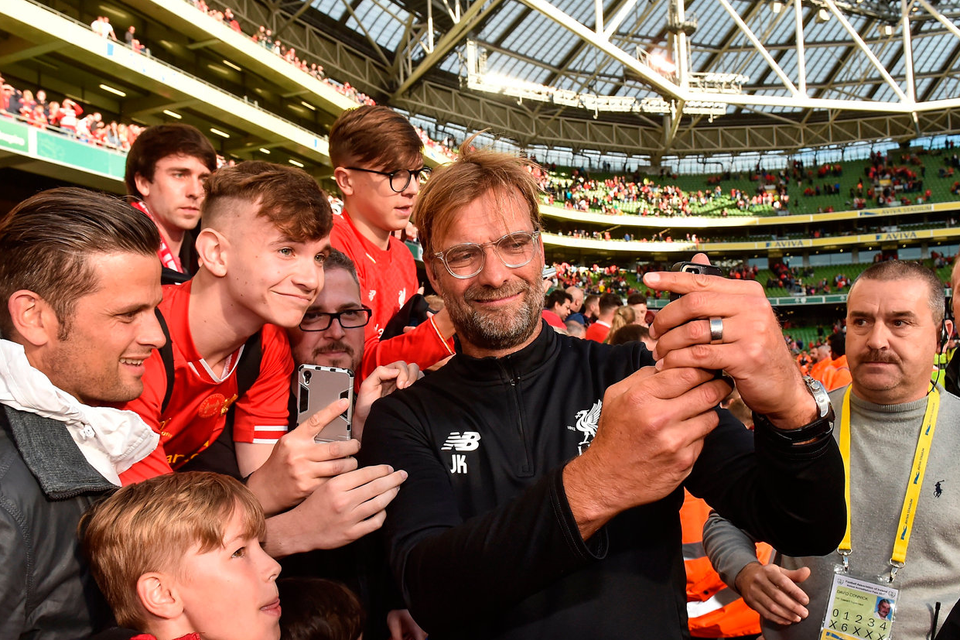 Liverpool manager Jurgen Klopp with supporters after the game