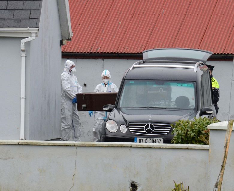 Mr Brogan's remains are removed from his home in Castlebar. Photo: Paul Mealey