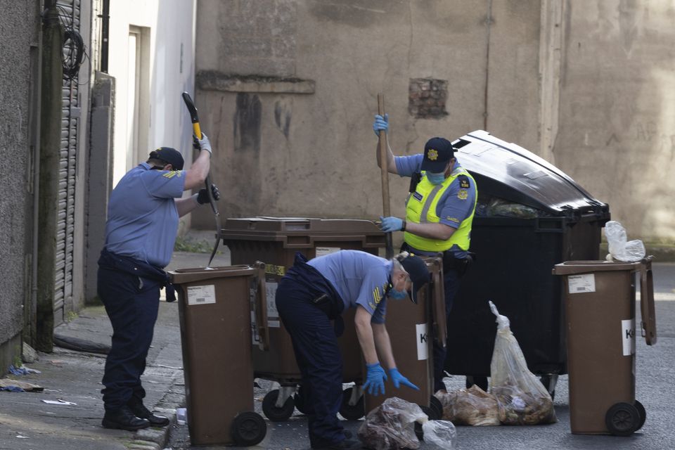 Gardaí searching through bins on Frederick Lane North. Pic: Sam Boal/Collins Photos