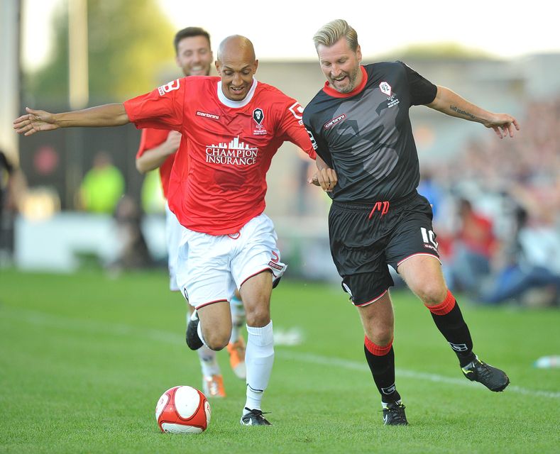 Class of 92's Robbie Savage and Salford City's Phillip Edgehill battle for the ball during the pre-season friendly at the AJ Bell Stadium, Salford. PRESS ASSOCIATION Photo. Picture date: Thursday August 7, 2014. See PA story SOCCER Salford. Photo credit should read: Dave Howarth/PA Wire