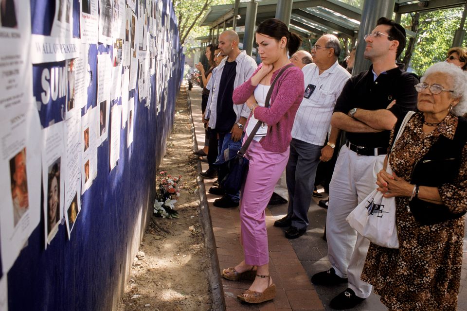 New Yorkers look at the posters of the missing after 9/11, as Cora Brady does in Confessions. Photo: Andrew Lichtenstein/Corbis via Getty Images