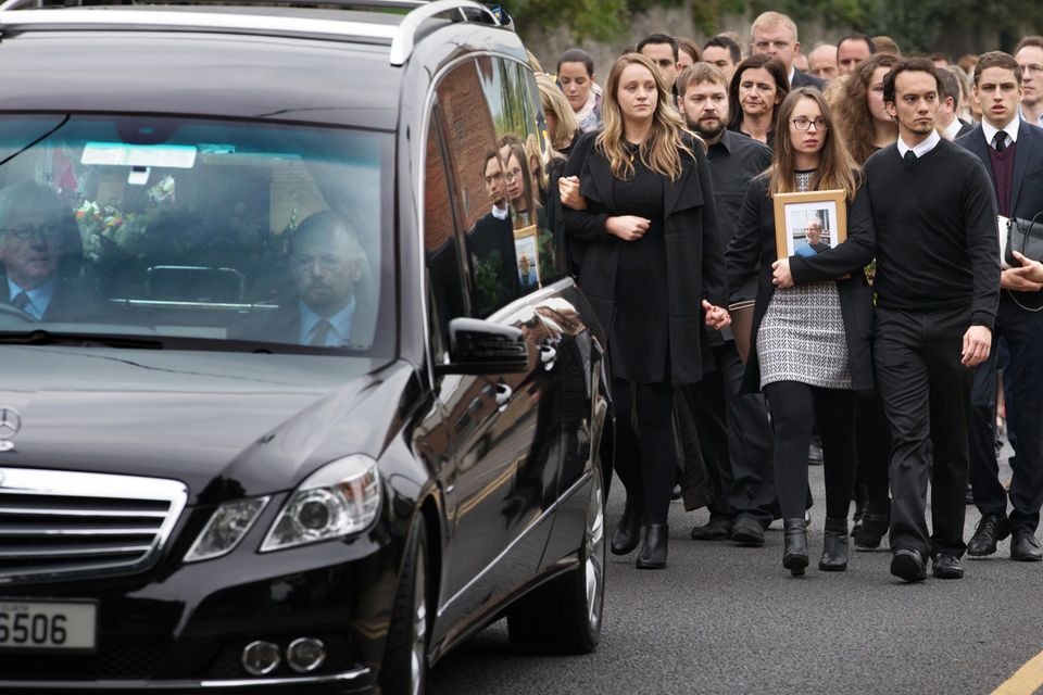 Mourners follow the coffin of Michael McCoy into St. Maelruain's Church of Ireland in Tallaght. Photo: Tony Gavin