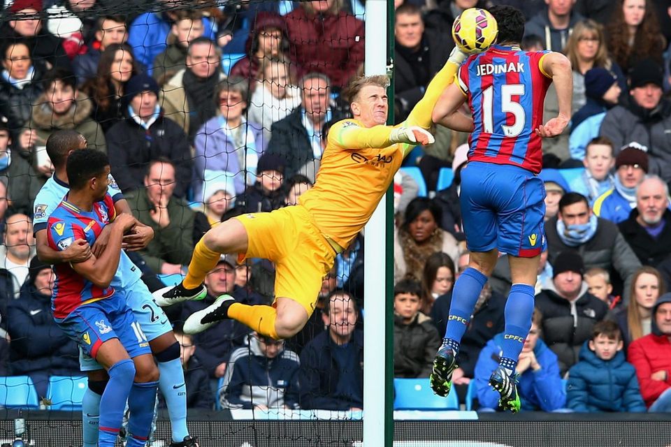 Manchester City goalkeeper Joe Hart makes a save from Crystal Palace captain Mile Jedinak's header during their Premier League clash at the Etihad. Photo: Michael Steele/Getty Images