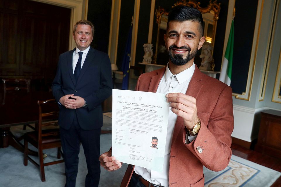 Then Minister of State James Browne TD with Zak Moradi as he received his Irish citizenship in 2021