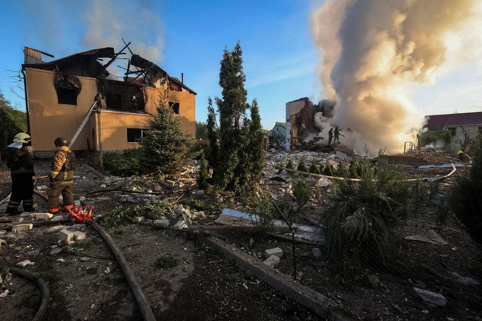 Firefighters work at a site of a Russian missile strike in Kharkiv, Ukraine, yesterday. Photo: Reuters