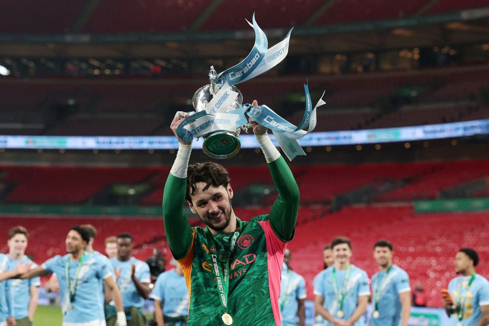 Manchester City's James Trafford celebrates with the Carabao Cup trophy last month