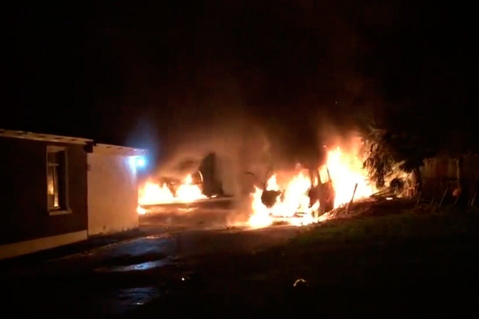 Probe: Cars left ablaze after the attack. Photo: ‘The Democrat’ newspaper, Roscommon