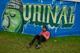 thumbnail: A reveller sits in the grass at the Glastonbury Festival of Music and Performing Arts on Worthy Farm near the village of Pilton in Somerset, South West England, on June 26, 2019. (Photo by Oli SCARFF / AFP)OLI SCARFF/AFP/Getty Images