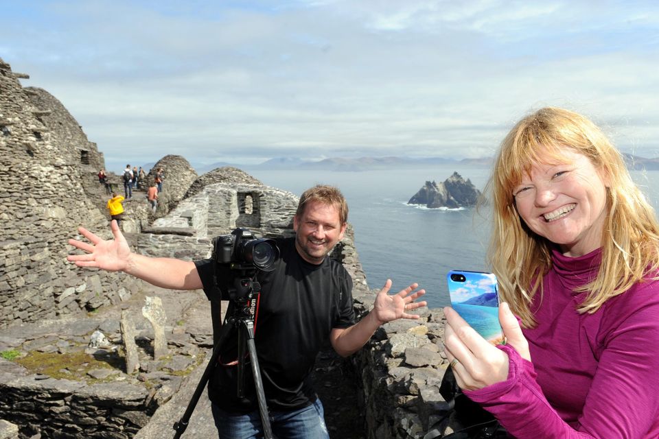 Canadian bloiggers Dave Bouskil and Dewbra Corbeilk who are travelling the Wild Atlantic Way pictured blogging from Skellig Michael on Good Friday. Picture: Don MacMonagle