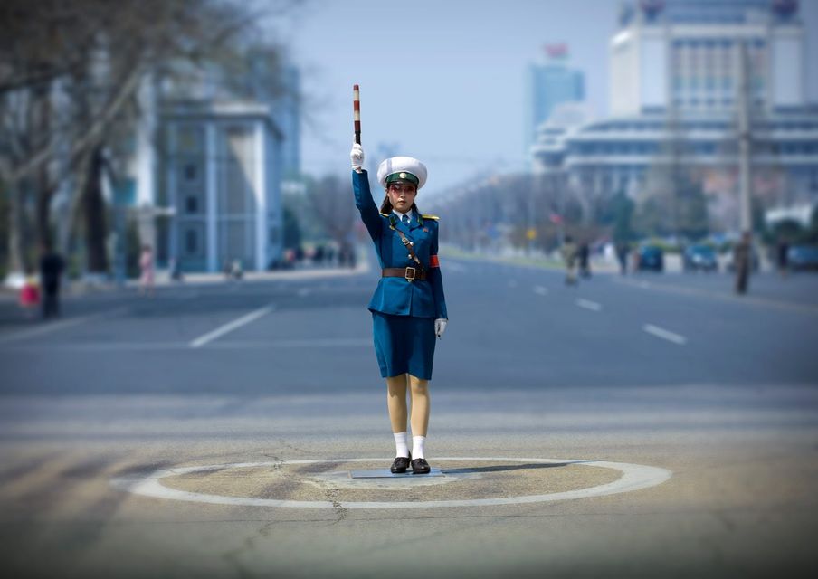 NORTH KOREA: Traffic officer in Pyongyang, where there are no traffic lights. Photo by Eric LAFFORGUE/Gamma-Rapho via Getty Images