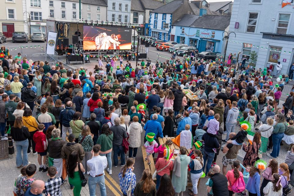 People attend a watch-along party in the town square of Ireland’s Eurovision entrant Bambie Thug’s hometown of Macroom in Co Cork, as the Eurovision final takes place at Malmo Arena (Noel Sweeney/PA)