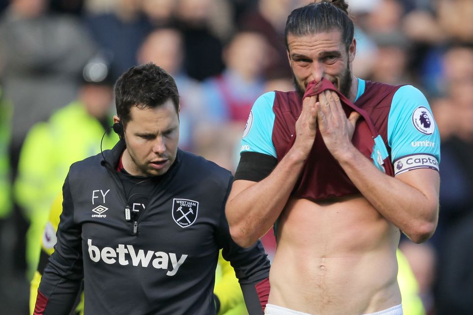 Andy Carroll, ight, has been plagued by injuries since joining West Ham