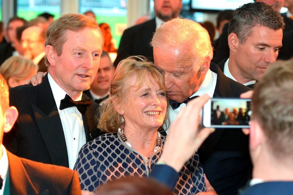 US Vice President Joe Biden hugs Seamus Heaney’s wife, Marie as they have their photo taken with Taoiseach Enda Kenny during the Ireland Fund’s 40th Anniversary Gala Dinner at Trinity College Credit: Barbara Lindberg.