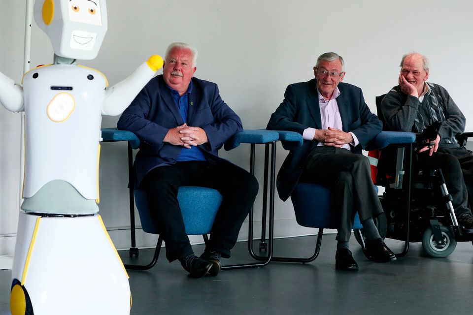 IrelandÕs first socially assistive AI robot 'Stevie II' from robotics engineers at Trinity College Dublin is unveiled during a special demonstration at the Science Gallery in Dublin, as Mick McCarthy (left) Tony McCarthy (centre) and Brendan Crean, who all helped trial the robot through the charity ALONE look on.
Brian Lawless/PA Wire