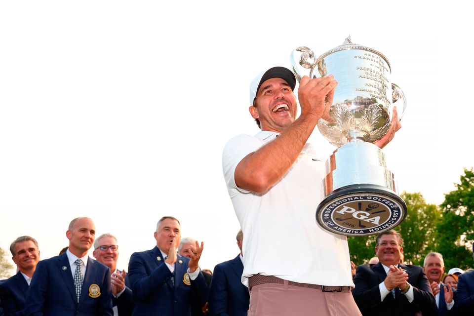 Brooks Koepka of the United States smiles after being awarded the Wanamaker Trophy in honour of winning the 2023 PGA Championship at Oak Hill Country Club on May 21, 2023 in Rochester, New York