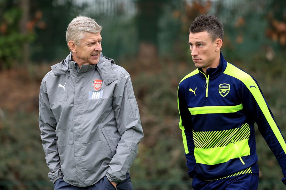 Arsenal manager Arsene Wenger (left) is expected to recall defender Laurent Koscielny (right) for the trip to Liverpool.