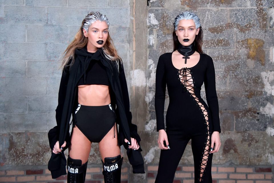 Models Stella Maxwell (L) and Bella Hadid pose backstage at the FENTY PUMA by Rihanna AW16 Collection during Fall 2016 New York Fashion Week at 23 Wall Street on February 12, 2016 in New York City.  (Photo by Jamie McCarthy/Getty Images for FENTY PUMA)