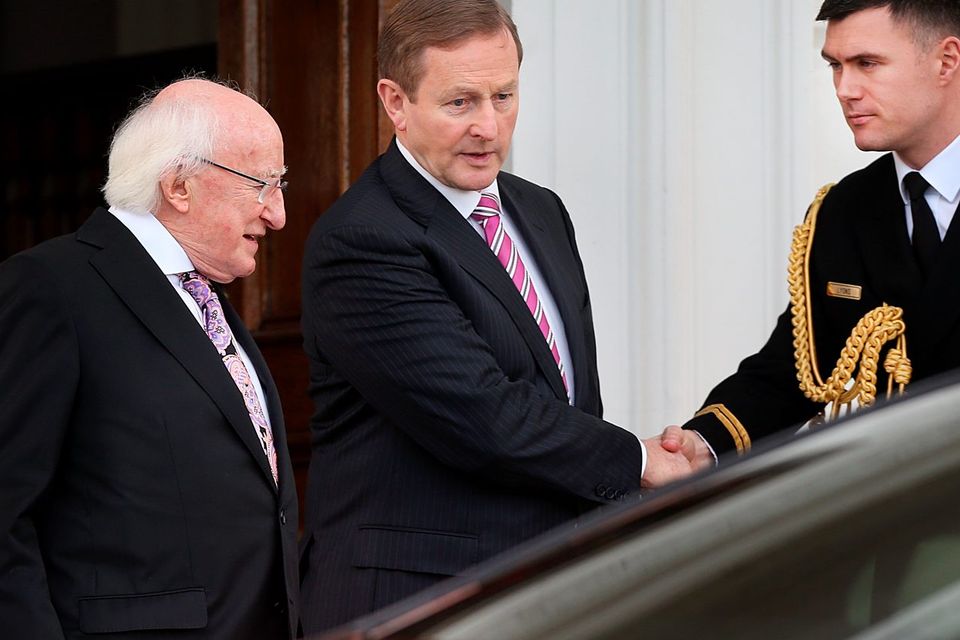 President Michael D. Higgins says goodbye to Taoiseach Enda Kenny at the Aras An Uachtarain where the Dail was dissolved. Photo: Steve Humphreys