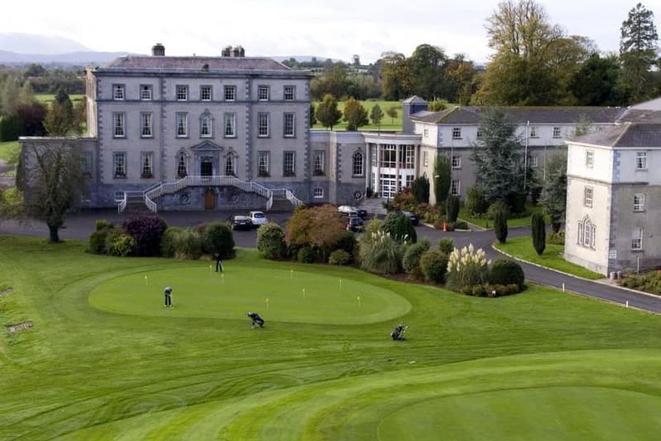 Local road diversions are in place and dozens of gardaí have secured the area around Dundrum House Hotel as the first group of international protection applicants is due to arrive
