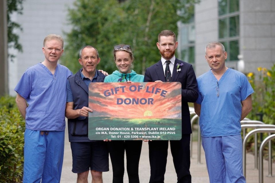 Transplant patient Ciara O'Connor with her father, Con (second from right), and medical personnel highlighting the importance of organ donation.