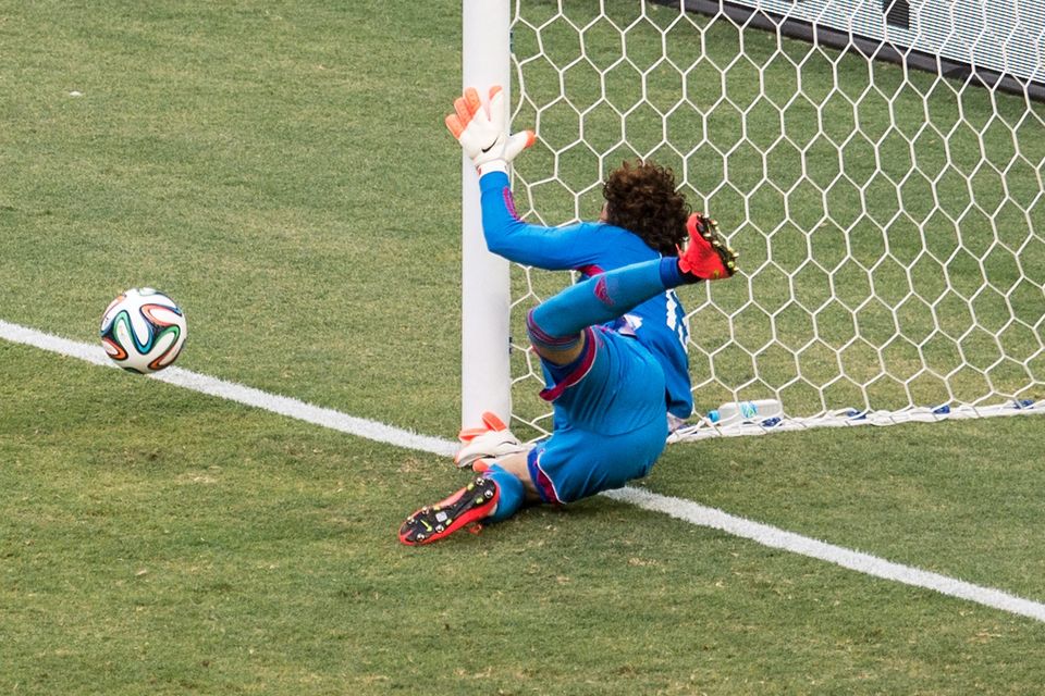 Guillermo Ochoa of Mexico makes a save during the 2014 FIFA World Cup Brazil Group A match between Brazil and Mexico