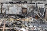 thumbnail: The Bot family home burnt to the ground on Good Friday. All that remains is ashes and debris and partial walls of a workshop. Photo by Michael Donnelly.